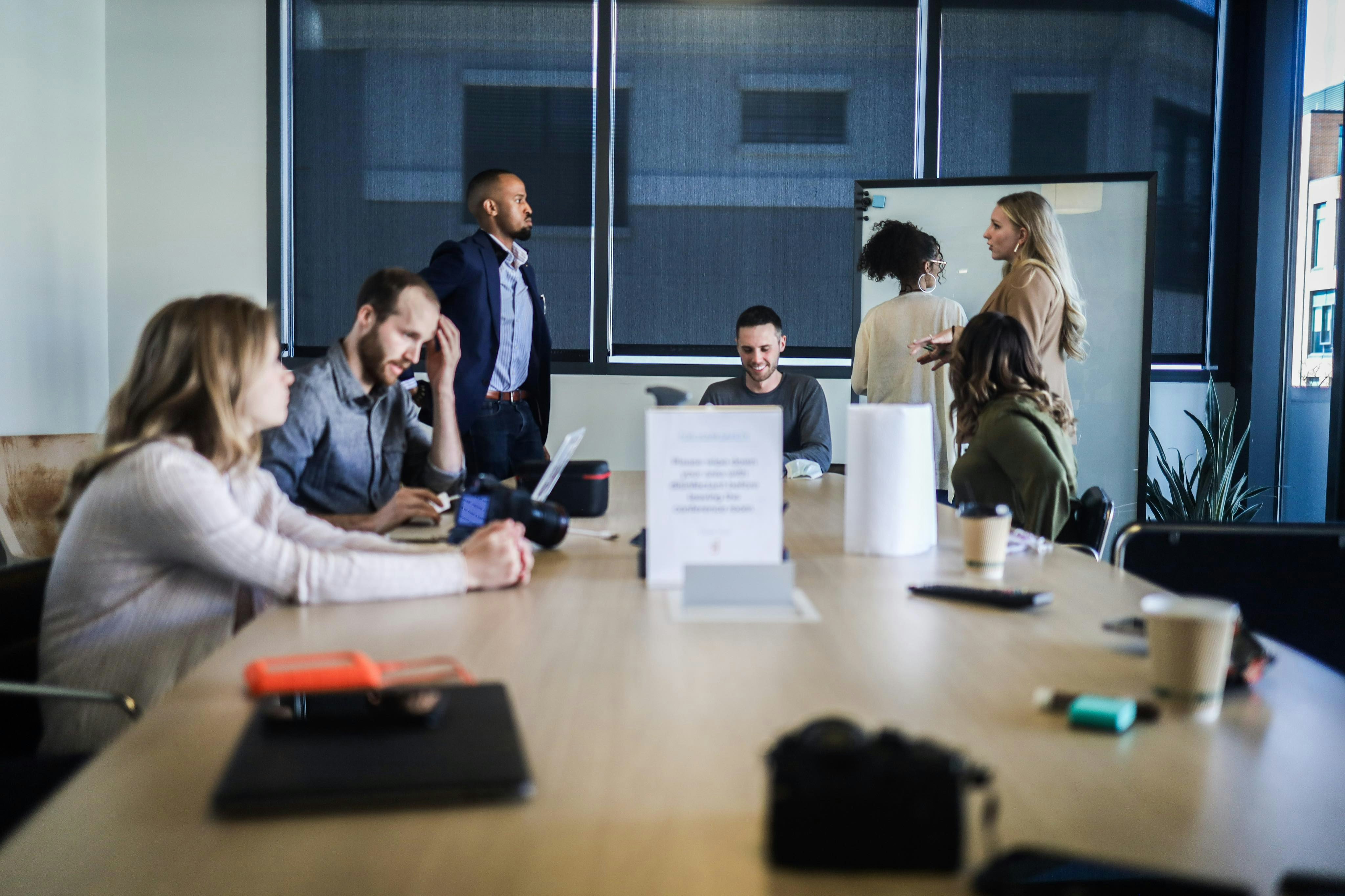 People sitting around a table in a meeting